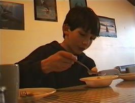 Clyde makes a meal of his bruised bananas at Perranporth Youth Hostel